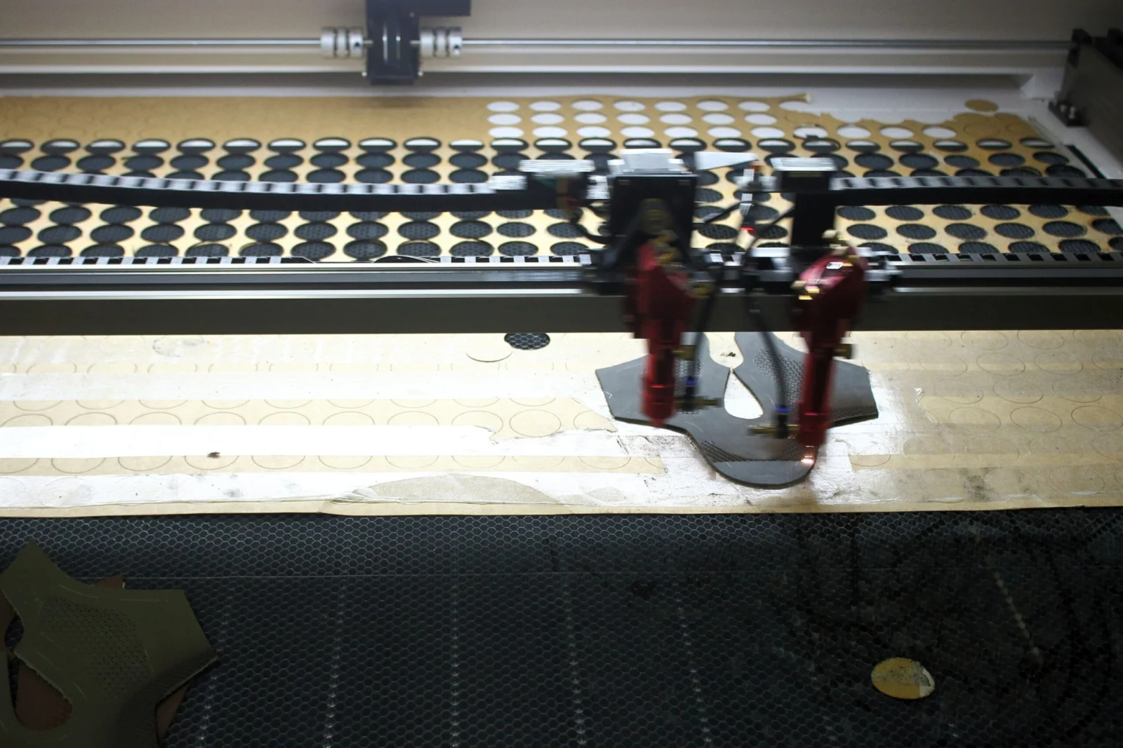 Cutting machine working on rows of footwear components